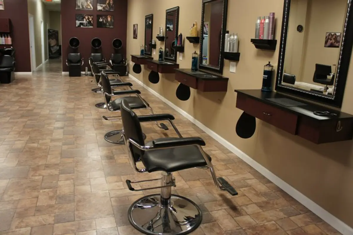 Modern beauty salon with styling chairs, mirrors, and professional hairstyling setup