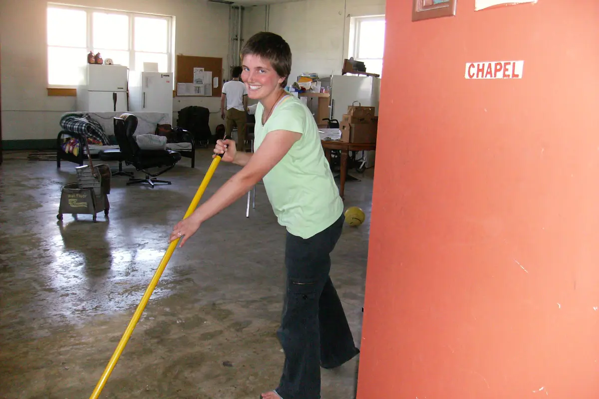 Professional residential cleaning: tidy living space with cleaning supplies and polished surfaces
